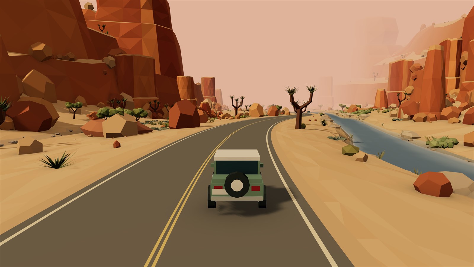 Driving through a red rock canyon beside a river