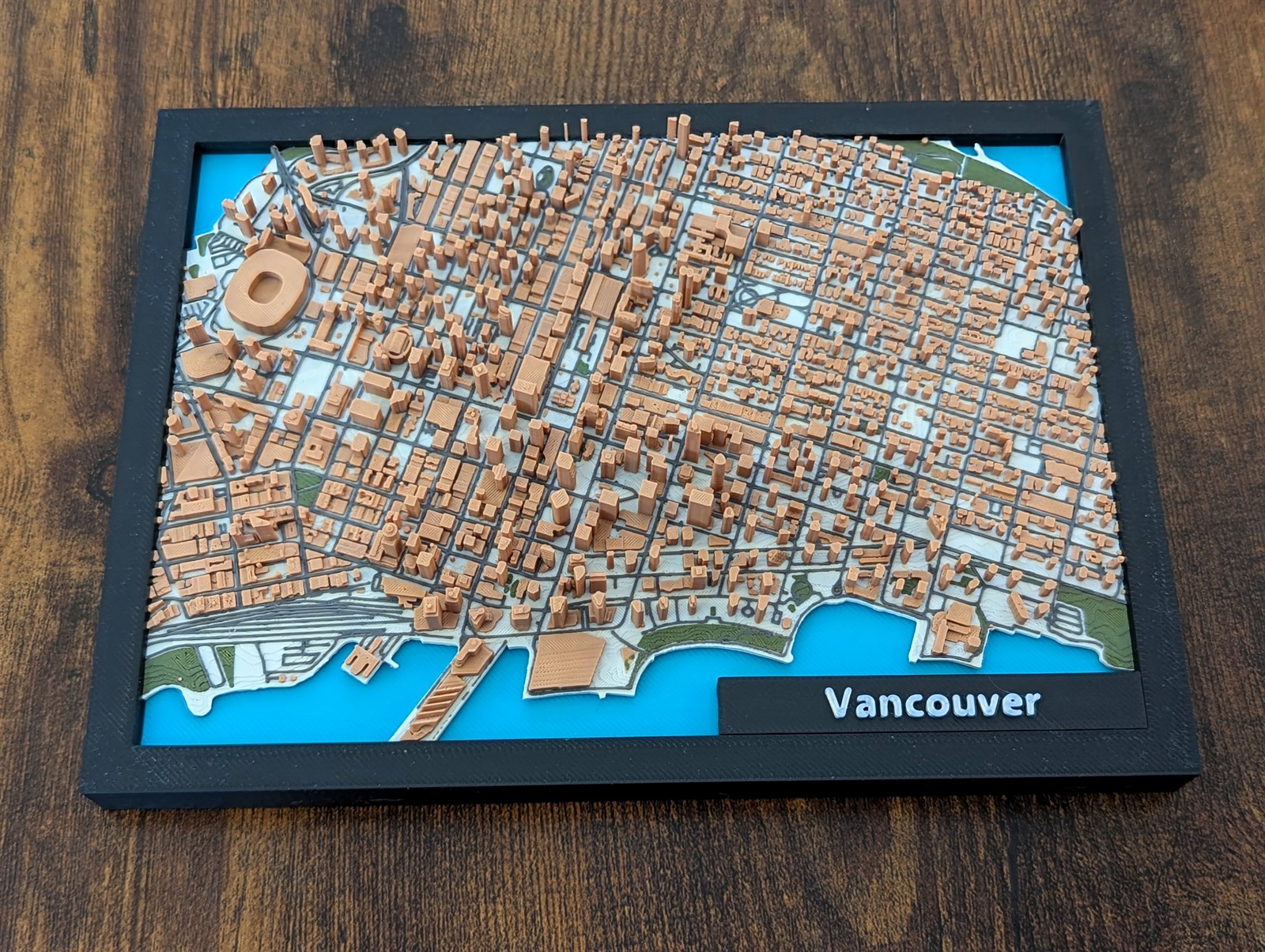 Framed 3D print of my manually designed Jarvizar Vancouver map, with detailed buildings, streets, and waterfront